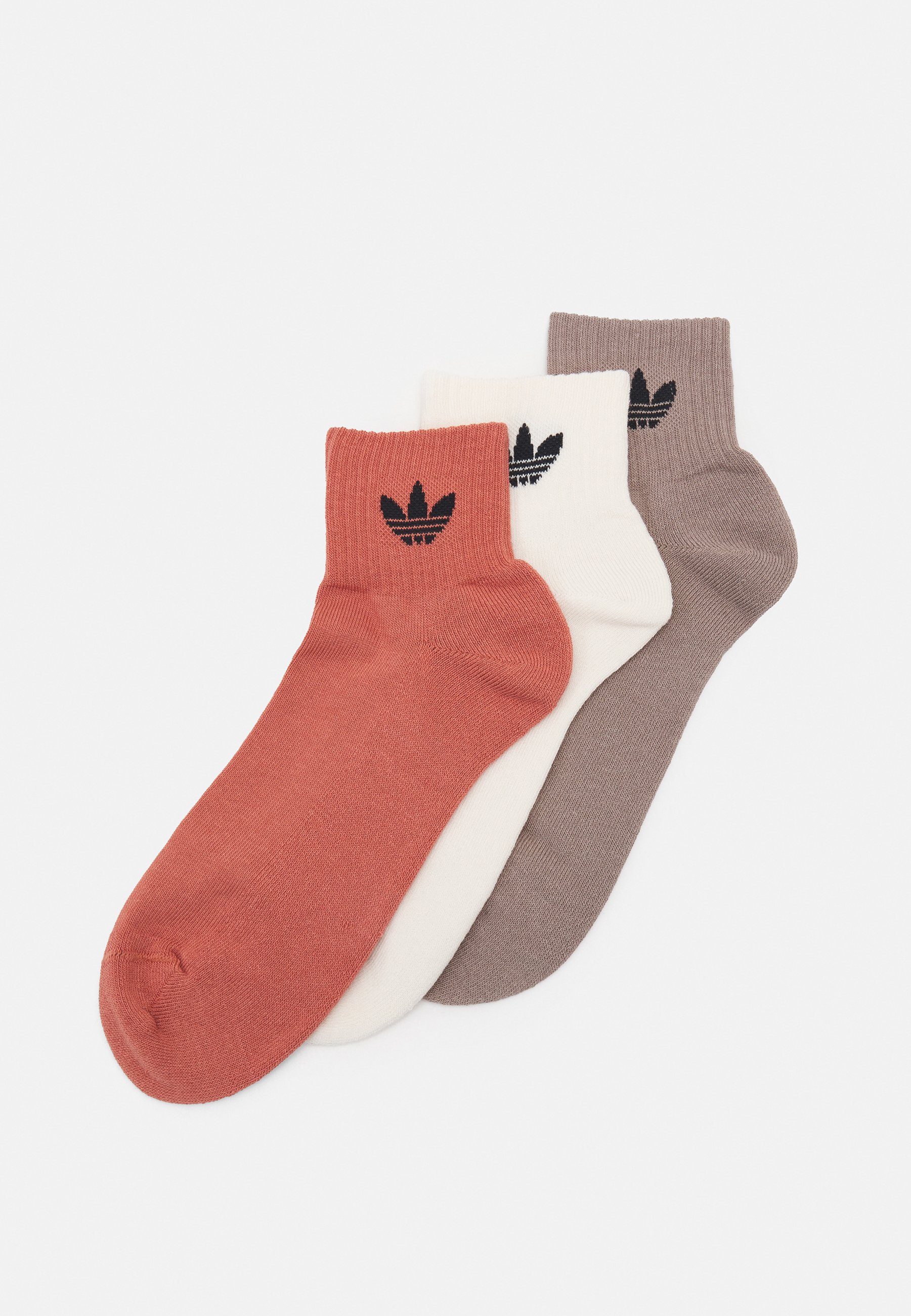 brown and white adidas