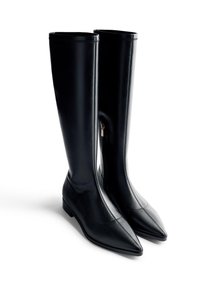 Black leather knee-high boots with a pointed toe, smooth texture, minimal design, and a side zipper detail. Flat sole for comfort.