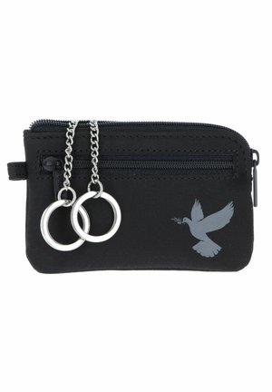 Petite pochette noire zippée avec une poche avant, deux anneaux de clés argentés sur chaînes, et une silhouette de colombe tenant un rameau d'olivier.