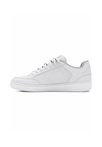 White athletic sneaker with a smooth, textured upper, lace-up design, round toe, and flat rubber sole. Features subtle side panel detailing.