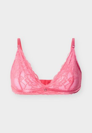 Ροζ δαντελένιο σουτιέν bralette με ρυθμιζόμενους ιμάντες και μικρό κρεμαστό διακοσμητικό σε σχήμα καρδιάς στο κέντρο μπροστά, απεικονισμένο σε λευκό φόντο.