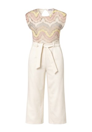 Top senza maniche con motivo ondulato pastello abbinato a pantaloni crema a vita alta e gamba larga con cintura annodata in vita.