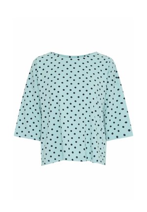 Hele sinine lühikeste varrukatega pluus, millel on mustad täpid, lahtine lõige ja lai kaelus. Sile kangas, millel on peen tekstuur.