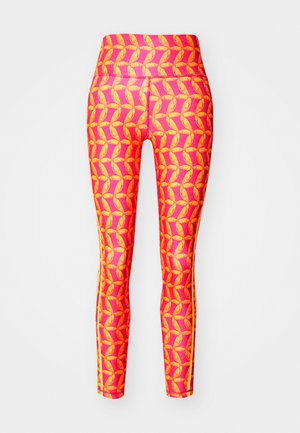 Legíny s jasně růžovým pozadím a oranžovým geometrickým vzorem listů. Obsahují vysoký pas a jednobarevné boční pruhy.