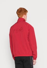 Jordan WARMUP - Casaco de verão - pomegranate