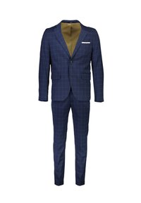 Laivastonsininen puku, jossa on vaalea ruutukuvio, yksirivinen nappilista, läppätaskut, valkoinen taskuliina ja sopivat slim-fit-housut.