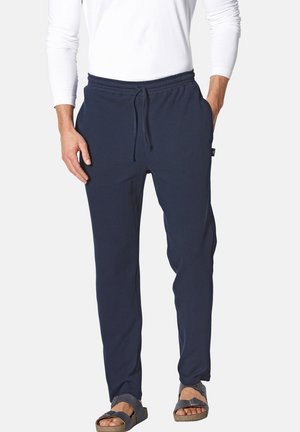 Hose im Marineblau aus weichem Stoff, mit einem elastischen Bund mit Kordelzug, Seitentaschen und einer lockeren Passform.