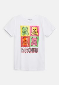 White short-sleeve T-shirt with four colorful teddy bears labeled "Toy" in green, yellow, orange, and pink blocks above the word "MOSCHINO".