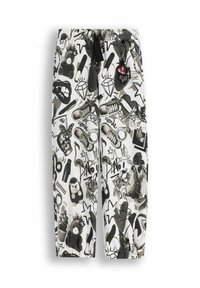 Czarno-białe spodnie w wzory z różnymi grafikami, takimi jak zwierzęta, diamenty i tatuaże. Zaprojektowane z elastycznym pasem i sznurkiem do wiązania.
