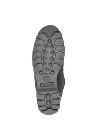 Suela de zapato de goma negra con agarre texturizado, que presenta un dibujo en relieve y un pequeño logo de Timberland en el talón.