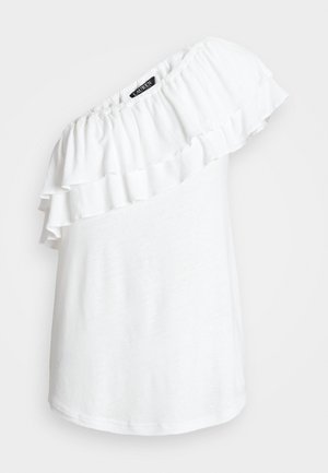 Biały top na jedno ramię z podwójną falbaną i elastycznym dekoltem, oznaczony "Lauren", na jasnym jednolitym tle.