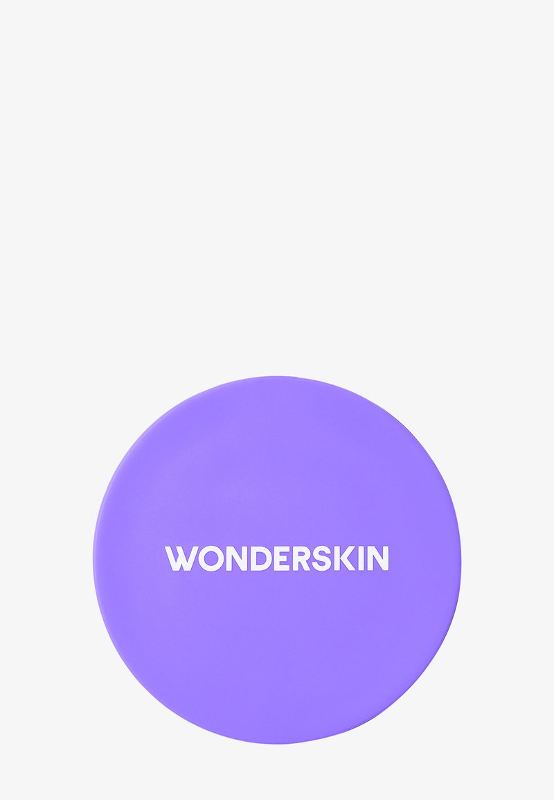 Compatto rotondo viola con una texture liscia e logo bianco "WONDERSKIN" in rilievo sulla superficie superiore.