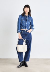 Calvin Klein EMBOSSED LOGO SMALL TOTE - Borsa a mano - gray morn