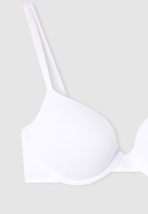 Reggiseno bianco con coppe lisce e imbottite, spalline regolabili e design senza cuciture. Realizzato in tessuto morbido e elasticizzato per il comfort.