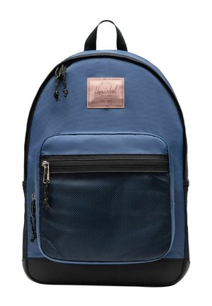 Sac à dos Herschel bleu et noir avec poche avant en mesh, deux curseurs de fermeture éclair et poignée supérieure sur fond blanc uni.