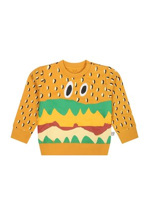 Felpa gialla con un design a hamburger, con motivi di semi di sesamo neri, dettagli verdi, gialli e rossi. Maniche lunghe e girocollo.