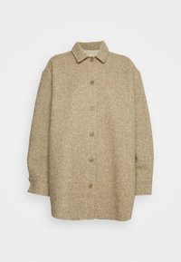 Veste tissée beige avec un col, des manches longues et une fermeture à boutons à l'avant. Dispose d'un tissu texturé avec un motif subtil.
