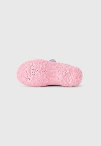 Pink rubber sole with floral patterns and a textured surface, featuring a smooth finish and small drainage holes.