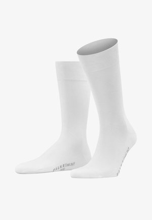 Witte katoenen sokken met een gladde textuur, geribbelde bovenrand en versterkte teen. Toont het 'FALKE Cool 24/7' merk op de onderkant.