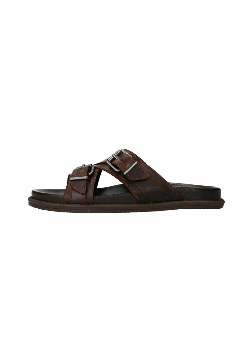 Bruine leren slip-on sandalen met twee verstelbare banden en zilverkleurige hardware accenten. Platte zool met een lichte textuur voor grip.