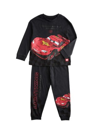 Black children’s pajamas featuring red race car Lightning McQueen from Cars, with text "Lightning McQueen" on pants and car graphic on top and legs.
