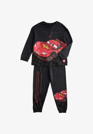 Black children’s pajamas featuring red race car Lightning McQueen from Cars, with text "Lightning McQueen" on pants and car graphic on top and legs.