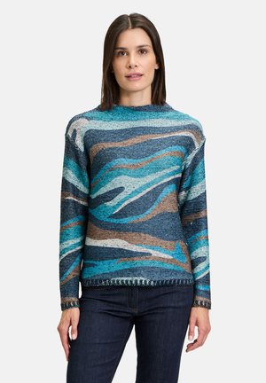 Multicolored knit sweater featuring wave patterns in blue, brown, and cream, with a round neckline and long sleeves. Textured fabric.