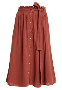 Rust-colored midi skirt with a paperbag waist, front buttons, and a matching fabric belt tied at the side.