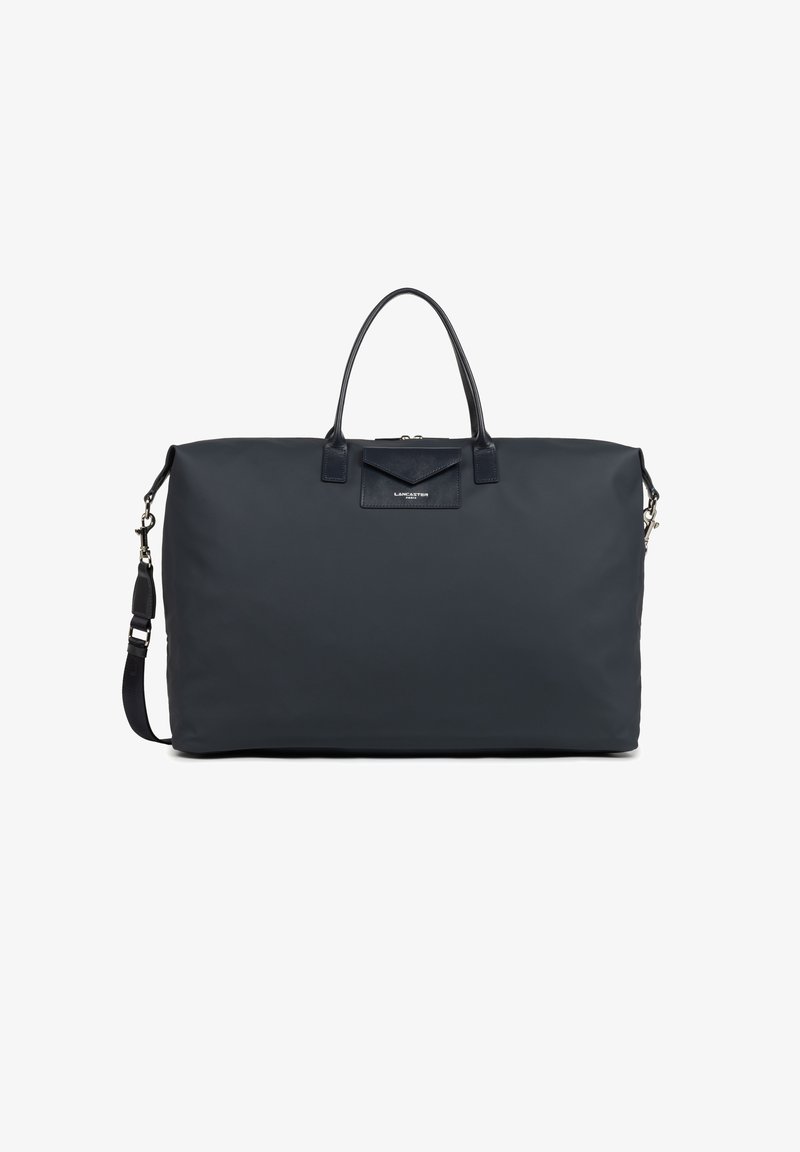 Marineblaues Nylon-Dufflebag mit doppeltem oberen Griff, verstellbarem Schultergurt und Lederakzenten. Verfügt über eine Fronttasche mit Klappenverschluss.