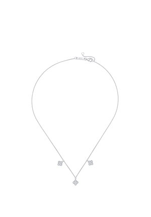 Delicate silver chain necklace with three small clover-shaped pendants adorned with clear stones evenly spaced along the chain.