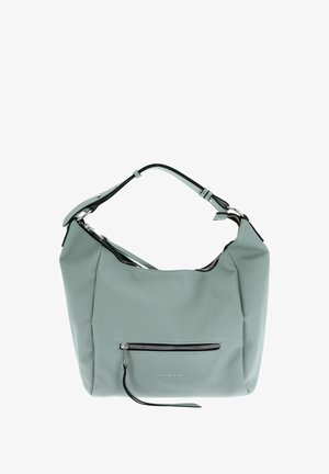 Sac à main en cuir vert clair avec une texture douce, une forme courbée, une bandoulière noire et une poche zippée à l'avant. Détails en métal argenté visibles.