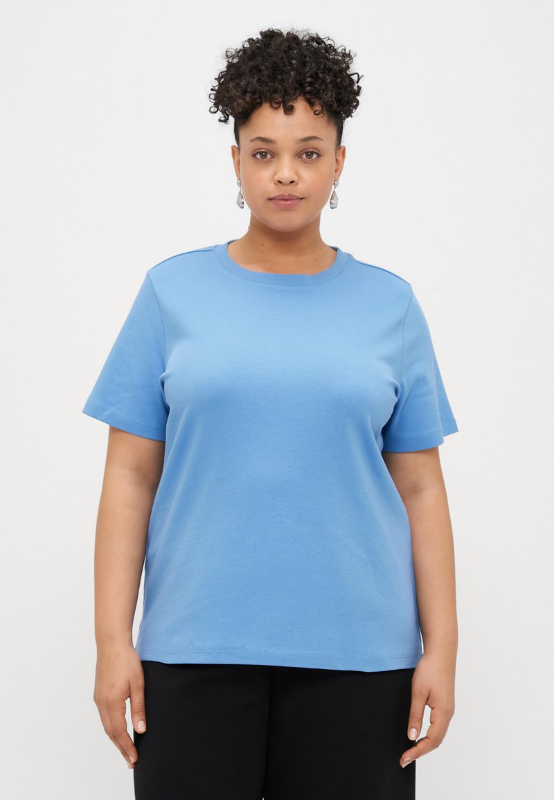 T-shirt de algodão azul com decote redondo, mangas curtas e um corte descontraído. Textura suave sem padrões ou detalhes visíveis.