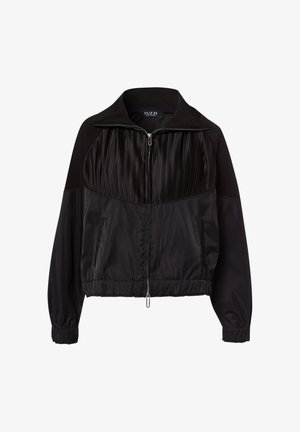 Black zip-up jacket with a collared neck, featuring pleated texture in the upper section and smooth, shiny lower fabric. Elastic cuffs and hem.