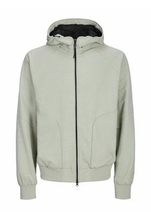 Svetlozelená bunda s kapucňou, so zipsovým uzáverom, elastickými manžetami a viditeľnými švom. Obsahuje dve predné vrecká a podšívku kapucne.