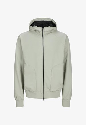 Svetlozelená bunda s kapucňou, so zipsovým uzáverom, elastickými manžetami a viditeľnými švom. Obsahuje dve predné vrecká a podšívku kapucne.