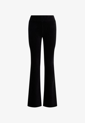 Pantaloni neri a costine con gamba svasata e vita alta. Il tessuto testurizzato presenta linee verticali, che esaltano la forma e il design. Senza hardware visibile.