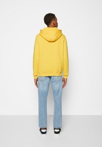 Tommy Hilfiger LOGO HOODY - Sweatshirt com capuz - warm yellow
