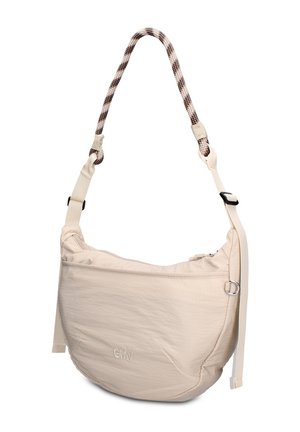 Sac bandoulière beige en forme de croissant avec poche avant zippée, sangle réglable et poignée tressée avec motif noir et blanc.