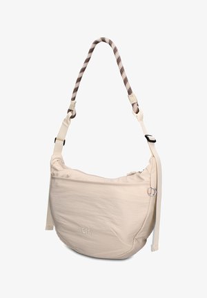 Beige crossbodytas in halve maanvorm met voorvak met ritssluiting, verstelbare riem en gevlochten handvat met zwart-wit patroon.