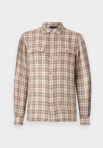 Košela na gombíky v hnedo-bežovej kárované vzore. Dlhé rukávy, dve náprsné vrecká s gombíkmi a golier. Zmes bavlny.