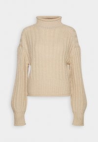 Pull à col roulé beige en tricot côtelé épais avec manches longues ballon et poignet ajusté sur fond uni.
