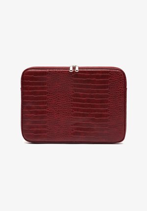 Red crocodile-embossed leather laptop case with a flat rectangular shape, zip closure, and silver-tone hardware accents. Smooth texture.