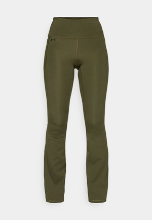 Olive green leggings with a high waistband, made of stretchy fabric. Features a side pocket and flatlock seams for comfort and flexibility.