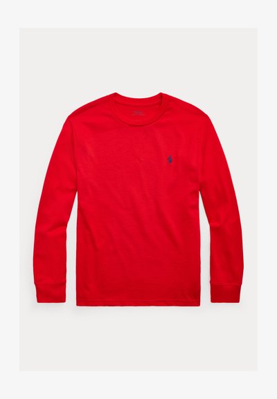 Red long-sleeve crewneck shirt with small blue embroidered logo on left chest, displayed flat on white background.
