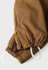 Brown insulated jacket sleeve with an elasticated hem, snap button, side pocket, and clear elastic loops for tightening. Textured fabric finish.