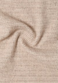 Beige vävd tyg med ett strukturerat rutmönster. Mjukt, varmt tillämning med subtila färgvariationer och en något fluffig framtoning.