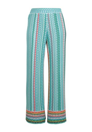 Patterned wide-leg trousers in turquoise, featuring zigzag stripes in pink, green, and red. Soft fabric with a textured finish.