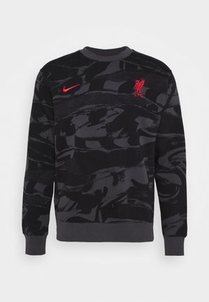 Sweat-shirt noir et gris foncé à motif camouflage avec logo Nike rouge sur la poitrine droite et emblème rouge du Liverpool FC sur la poitrine gauche.