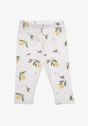 Baumwollleggings mit weißem Grund und einem Muster aus Zitronen und Blättern. Weiche Textur, elastischer Bund und taillierte Passform.