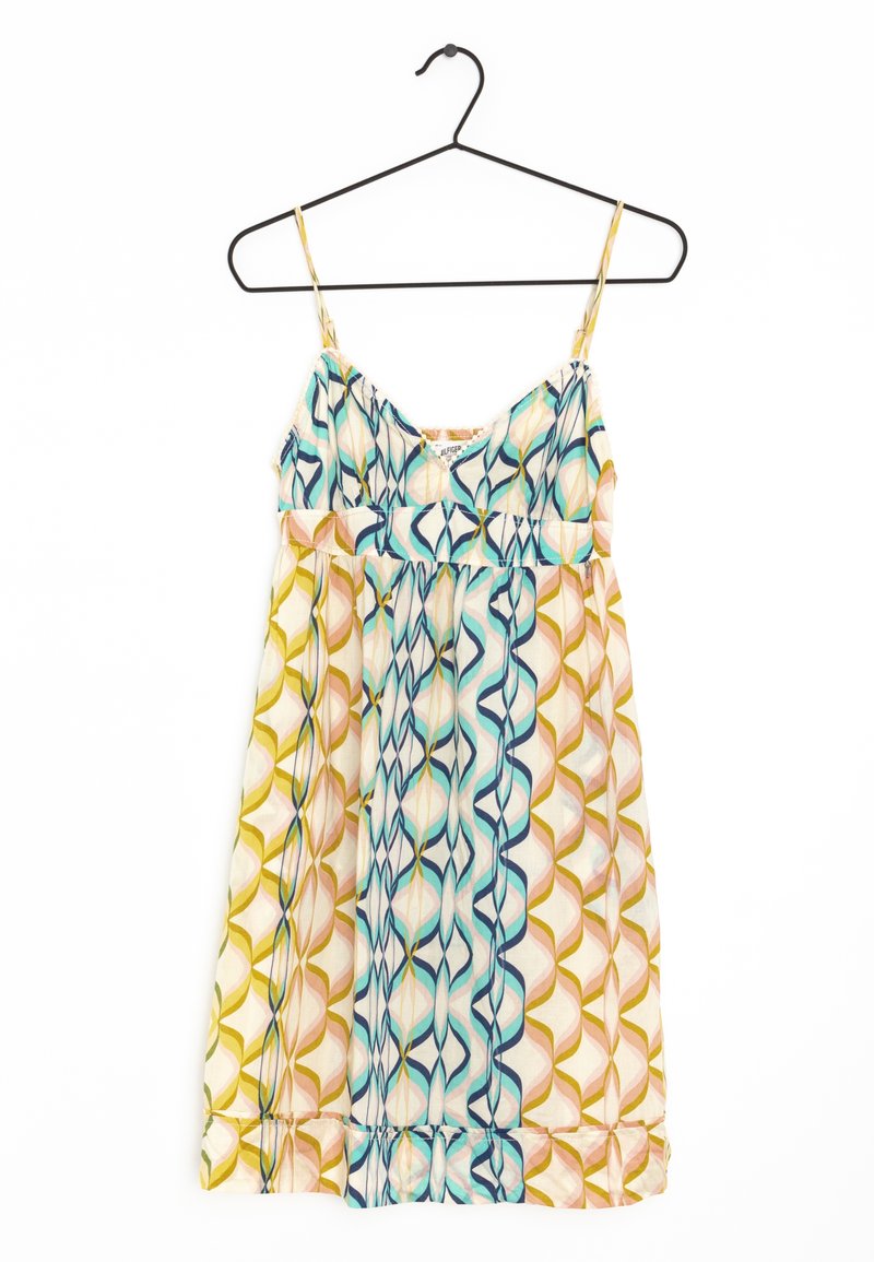 Robe d'été sans manches avec fines bretelles suspendue sur un cintre noir, présentant un motif géométrique multicolore dans des tons jaunes, bleus et roses.